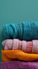 Canvas Print - Multicolored knitted clothes background. Handmade or factory-made clothes. Cozy knitted things