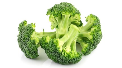 Wall Mural - Fresh broccoli placed against a white backdrop