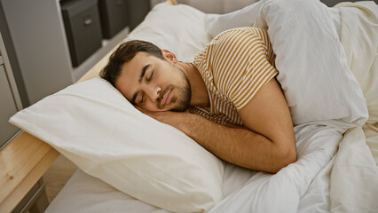 Canvas Print - A young hispanic man with a beard sleeps peacefully in a bedroom, showcasing a serene indoor scene.