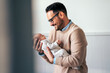 © NDABCREATIVITY - Portrait of young father holding his newborn baby. Fatherhood love single dad fathers day concept.