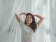 © mirifadapt - Happy young woman stretching in bed waking up alone happy concept, in cozy comfortable bedroom, enjoy good morning
