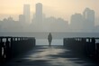 © Xyeppup - Solitary figure on a bridge, early morning fog, city skyline in the distance, contemplative mood, wide shot