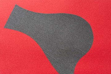 Wall Mural - abstract cut vinyl shape (gray glitter) on red paper