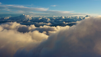 Wall Mural - aerial view of clouds at sunrise