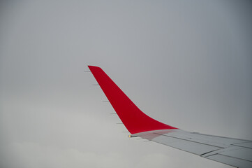 flying an airplane during fog. airplane wing and fog in the background.