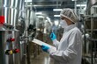 © HQ2X2 - Quality Control in Food Processing Plant. Factory Worker Inspecting Industrial Equipment