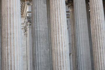 Poster - A group of columns with a clock on top, suitable for architectural and time-related concepts.