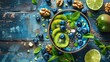 © lililia - a colorful smoothie bowl adorned with blueberries, kiwi slices, mint leaves, walnuts, chia seeds, and lime juice, presented beautifully on an old wooden table.
