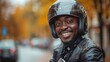© AS Photo Family - Smiling African American Biker Putting on Helmet in Autumn Scene