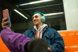 © ADDICTIVE STOCK - Young man enjoying music and social media on subway ride