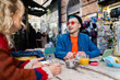 © ADDICTIVE STOCK - Young man enjoying coffee at a street cafe in the city