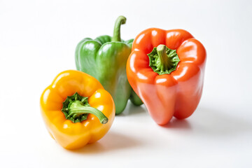 Canvas Print - Colorful Bell Peppers on a White Background