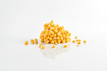 Wall Mural - Heap of Corn Kernels on White Background