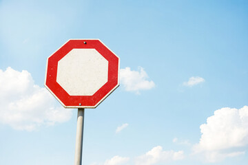 Wall Mural - Stop sign against blue sky