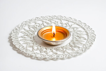 Canvas Print - A Single Candle Burning in a Silver Dish