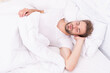 © be free - Lying with closed eyes. Deep male sleep. Man sleeping at night. Sleepy man lying on bed sleeping at white bedroom. Asleep young man sleeping. Resting peacefully in comfortable bed. Gentle snooze