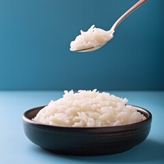 Boiled cooked white Basmati rice on blue background