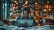© BOONJUNG - A man is sitting at a desk with a laptop and document, Overwhelmed feeling stress