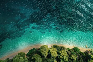 Wall Mural - Aerial view of a pristine beach with turquoise waters and lush green vegetation. Perfect for travel and nature-themed projects.