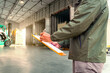 © Siwakorn1933 - Workers hold clipboards and check forklift loading of goods into containers. Deliver package to customers. distribution warehouse, freight transport, freight trucks, logistics transportation.