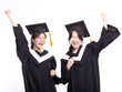 © Tom Wang - Happy and success girl friend graduates  in cap and gown