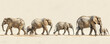 © Coosh448 - A panoramic image of a family of elephants walking in a single file, their trunks swaying in rhythm.