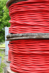 Sticker - Two spools of high-voltage red electrical cable in the power companys warehouse