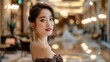 © songwut - A beautiful Korean girl, dressed in an elegant evening gown, posing in a luxurious hotel lobby, emphasizing her sophisticated and glamorous look. -