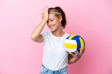 Young Russian woman playing volleyball isolated on pink background has realized something and intending the solution