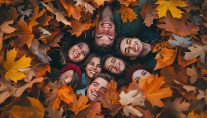 Wall Mural - A group of people are smiling and posing in a circle of leaves