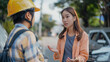 © atitaph - A young Asian woman stands and talks with the other party or insurance agent after Car crash on the highway Car accident on slippery road Drunk driving car accident insurance