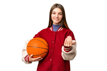 Teenager girl playing basketball over isolated chroma key background inviting to come with hand. Happy that you came