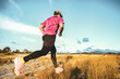 © STOCK PHOTO 4 U - Man Running Outdoors in Nature with Mountains in Background on a Sunny Day