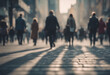 © FrameFinesse - Anonymous crowd of people walking on city street background