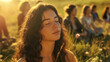 © Maksym - Womanâs tranquil face in close-up, deeply immersed in meditation amidst a group in a sunlit meadow, embodying mindfulness.