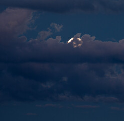 Wall Mural - full moon hiding behind the clouds
