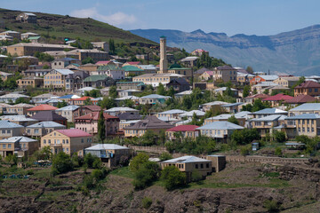 Wall Mural - View of the modern part of the mountain village of Kubachi on a sunny May day. Dagestan, Russia