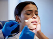 © Lumeez23/peopleimages.com - Woman, hands and scared for dental surgery in clinic with fear for teeth removal and treatment with doctor. Female person, dentist and worry or nervous in consultation with canal procedure for health