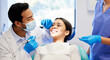 © peopleimages.com - Oral care, dentist and procedure with patient for health, wellness and teeth whitening in practice. Happy woman, ppe and dental specialist with tools for consultation, cleaning and filling on chair