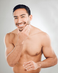 Poster - Asian man, hand and portrait of grooming in studio for morning routine, wellness or natural treatment on white background. Skincare, body and model with smile for confidence, facial or satisfaction
