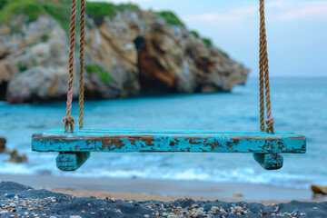 Wall Mural - wooden swing on the beach seascape background