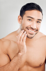 Poster - Skincare, hand and man portrait in studio for morning routine, wellness or natural treatment on white background. Grooming, body and model with smile for confidence, facial hygiene or satisfaction