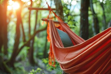 Poster - A hammock hanging from a tree in a serene forest setting, perfect for outdoor relaxation and nature escapes