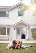 © peopleimages.com - Portrait, kiss or happy family in backyard at new house, real estate and garden in residential neighborhood. Mother, father and child outside with love, care or property investment on grass or lawn