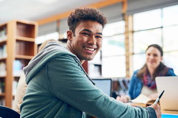 Poster - Student, man and happy with portrait in library for writing, scholarship and studying for exam knowledge. Gen z, person and smile for learning, education and research notes for university assessment