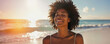 © mozZz - Smiling mature African woman on beach at sunset, happy free relaxed, feeling well enjoying ocean air