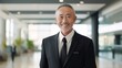 © sorin - Confident senior asian businessman in professional attire, exuding success in office environment