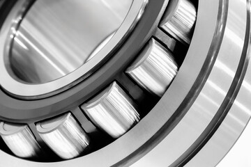 Aufkleber - A silver and bearing. The bearing is made of metal and has a shiny surface, Industrial concept background