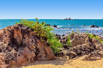 Wall Mural - View of large rocks along the shore of the South China Sea. Sky Grottoes Park, Sanya, China