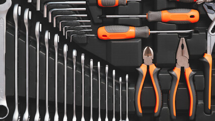 Poster - A toolbox with many different tools including pliers, wrenches, and screwdrivers. The tools are organized in a way that makes it easy to find what you need
